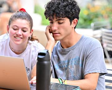 Pitt students at computer.