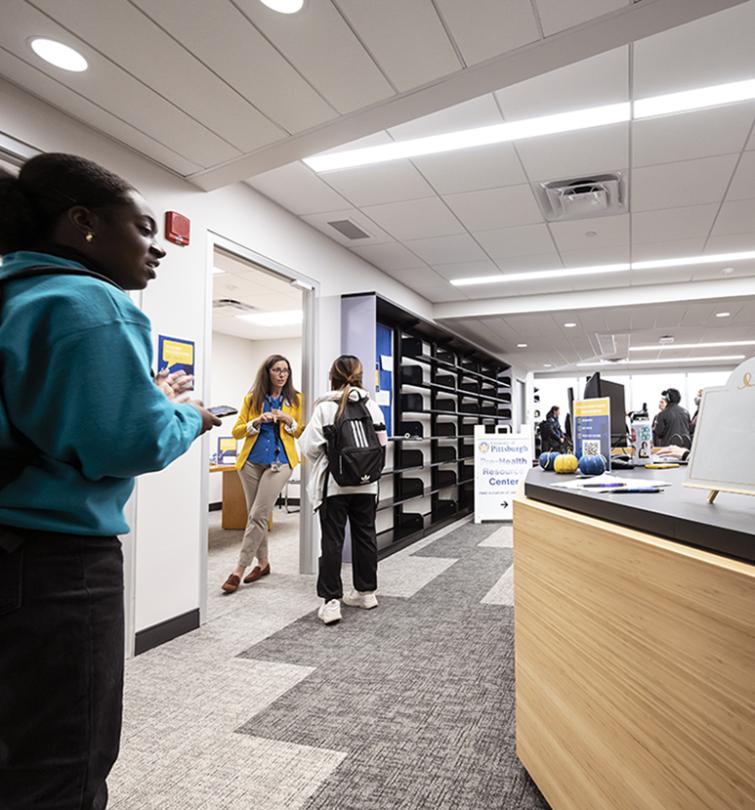 Students standing in Student Success Hub