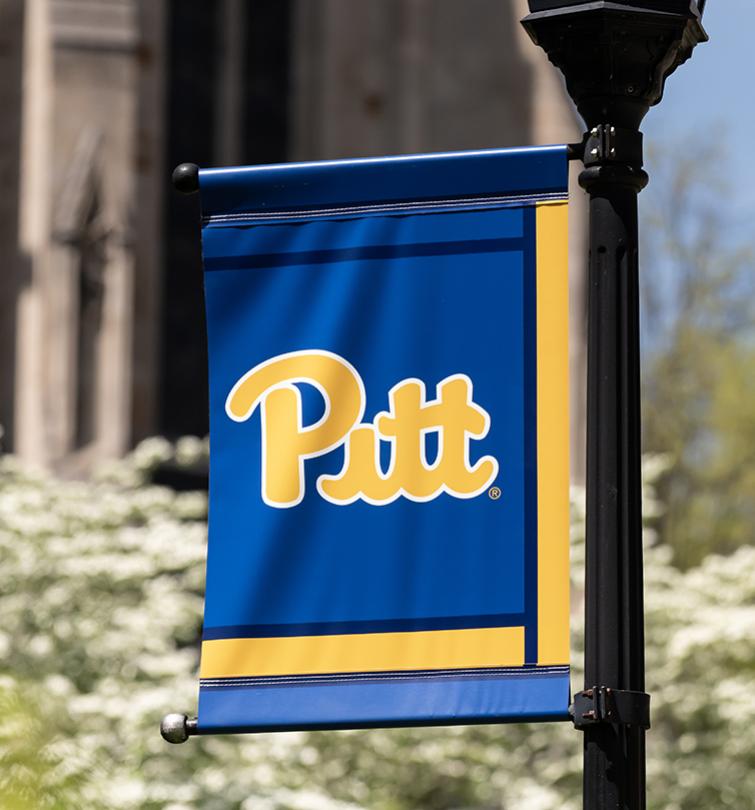 A blue and yellow flag with the Pitt script in yellow.