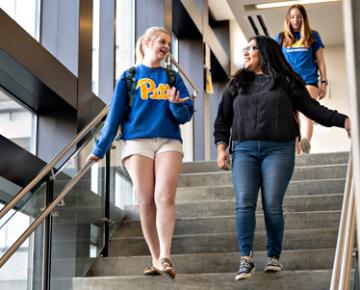 Students walking down steps.