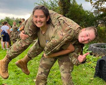 Cadet carrying another cadet on back