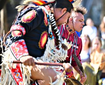 Campus cultural performance held outside.